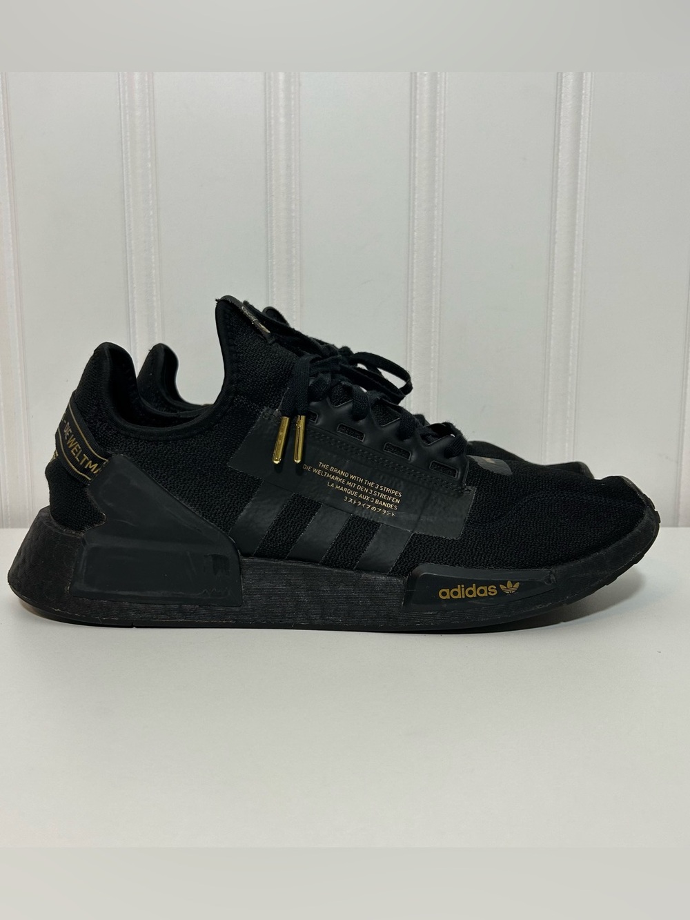 adidas nmd Black Sneakers with Gold Accents